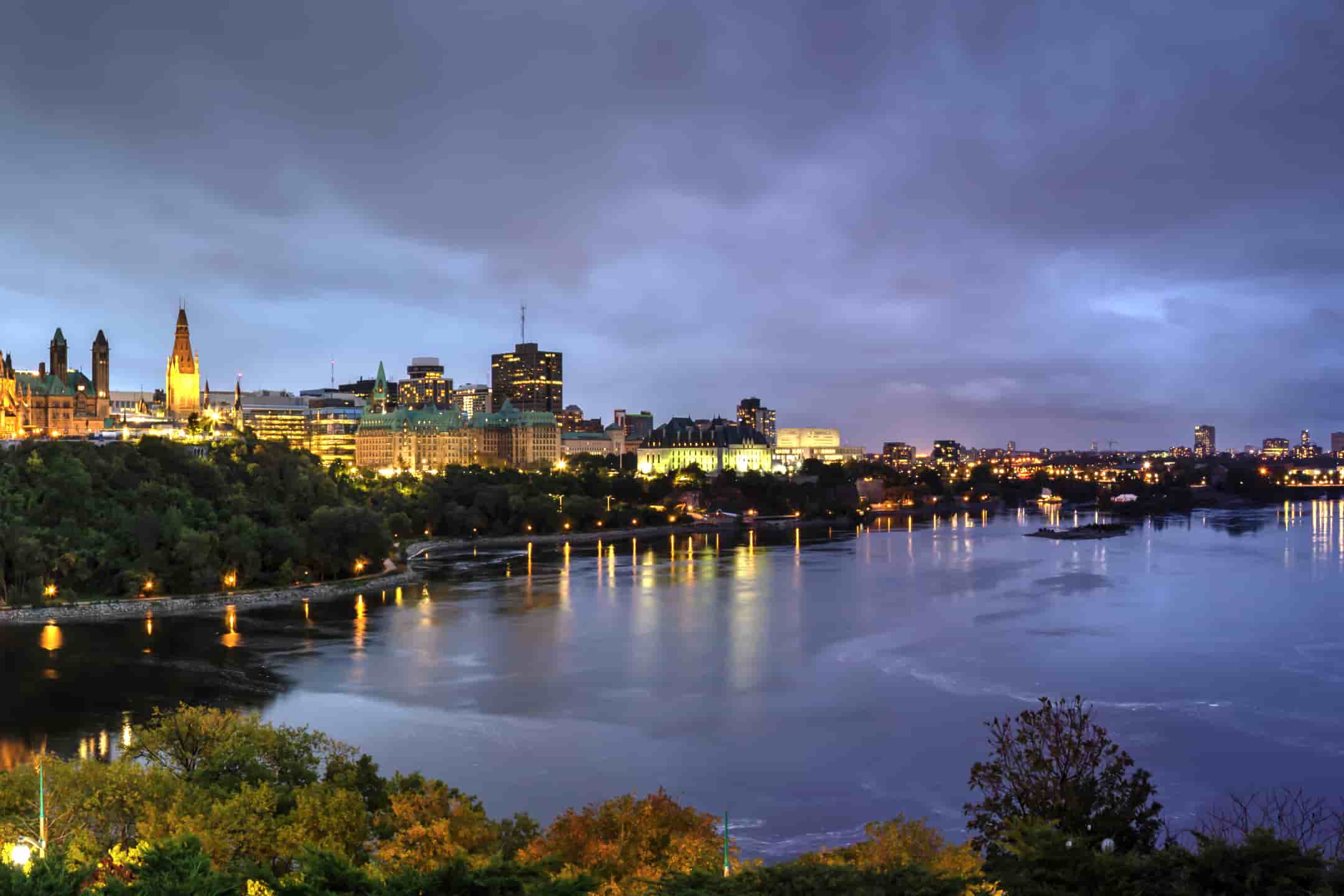Ottawa skyline at dusk by the river
